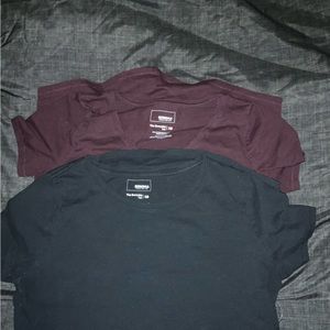 Two womens tee’s. One is maroon the other black.